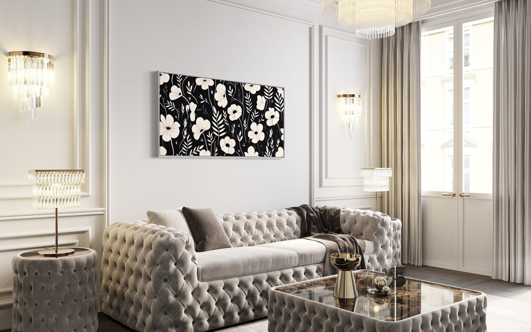 Black And White Flowers Framed Canvas Wall Art above white couch