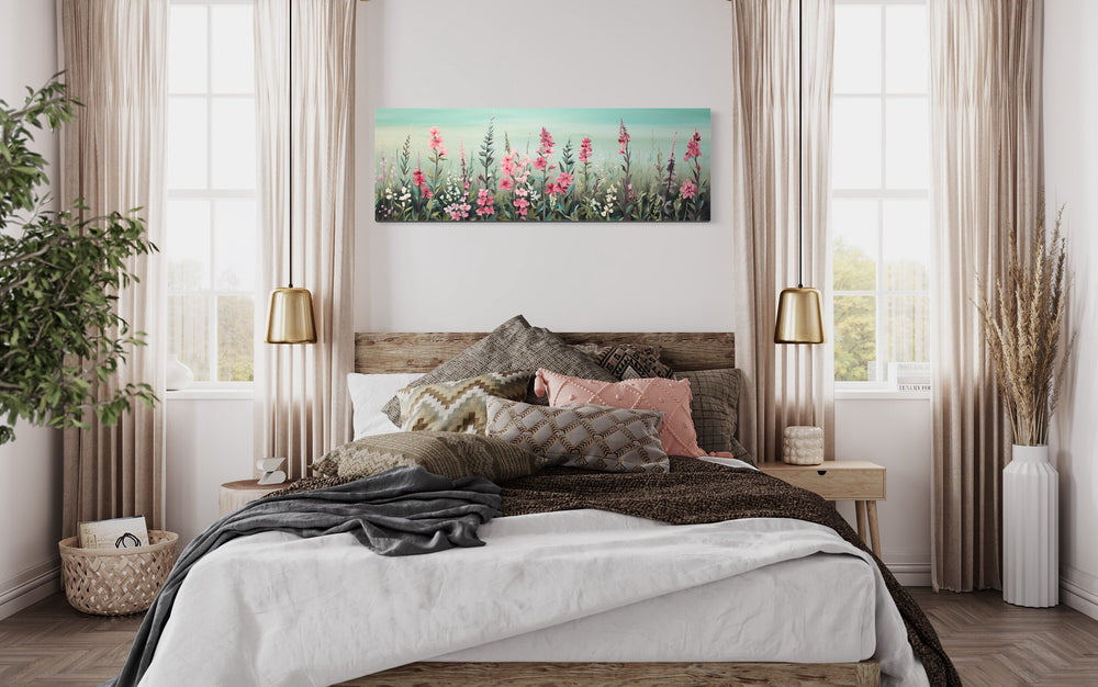 Green And Pink Wildflowers Field Panoramic Canvas Wall Art above bed