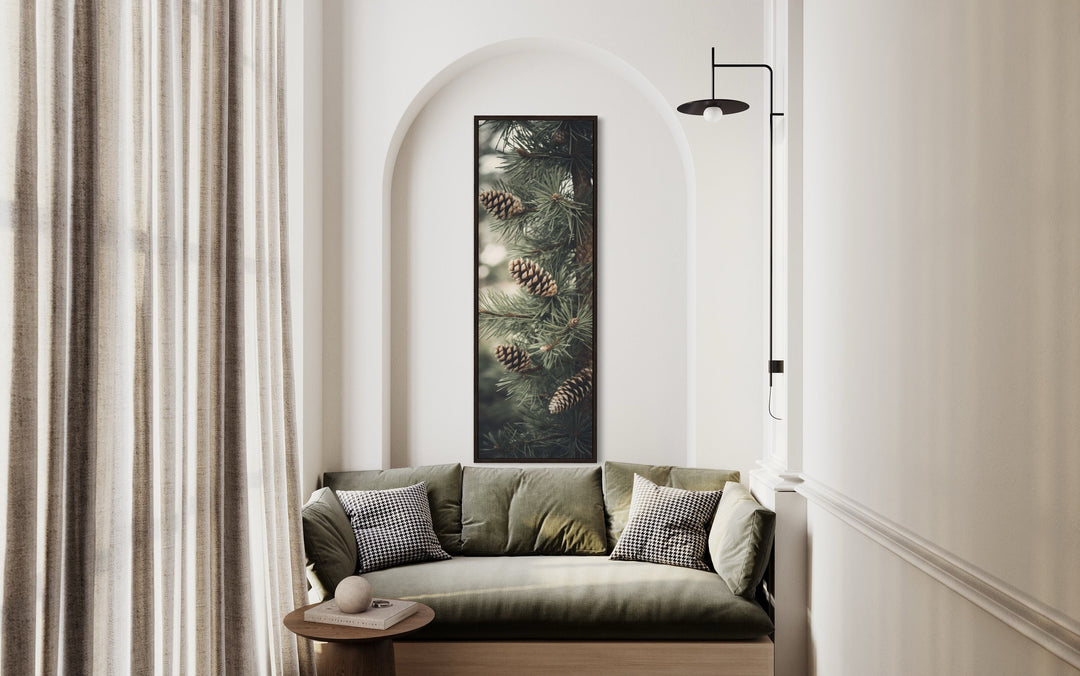 Tall Narrow Pine Tree With Pine Cones Vertical Framed Canvas Wall Art above green couch