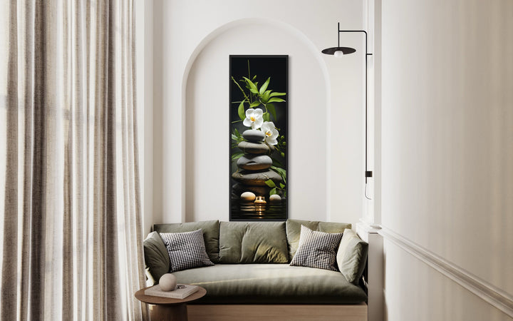 Tall Narrow Vertical Zen Stacked Rocks, Candle and Bamboo Wall Art above green couch