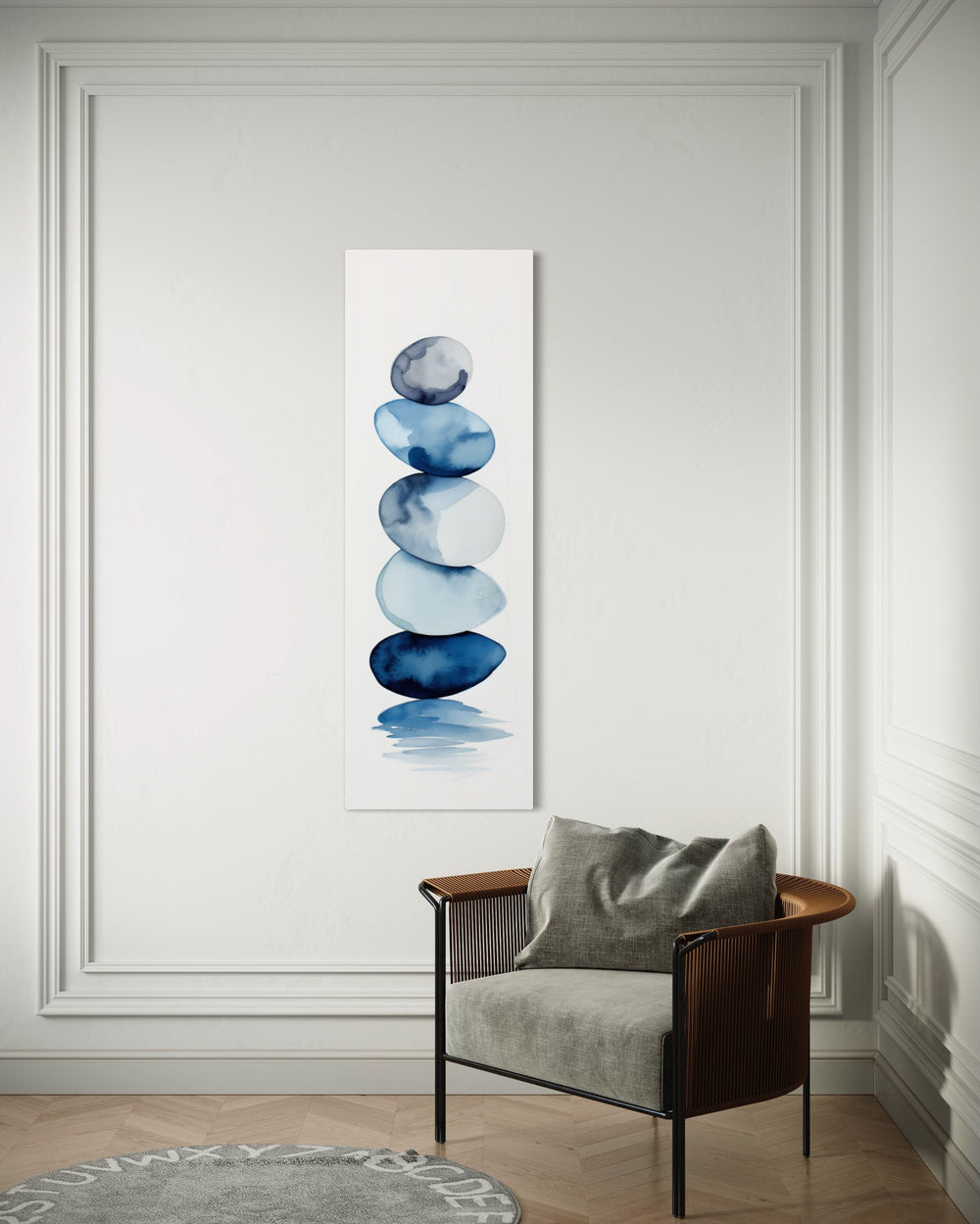 Tall Narrow Navy Blue White Stacked Rocks Vertical Wall Art behind armchair