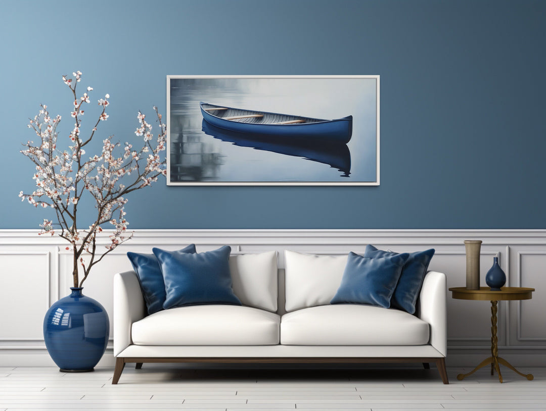 Blue Canoe Extra Large Wall Art "Tranquil Paddle" over white couch with blue pillows