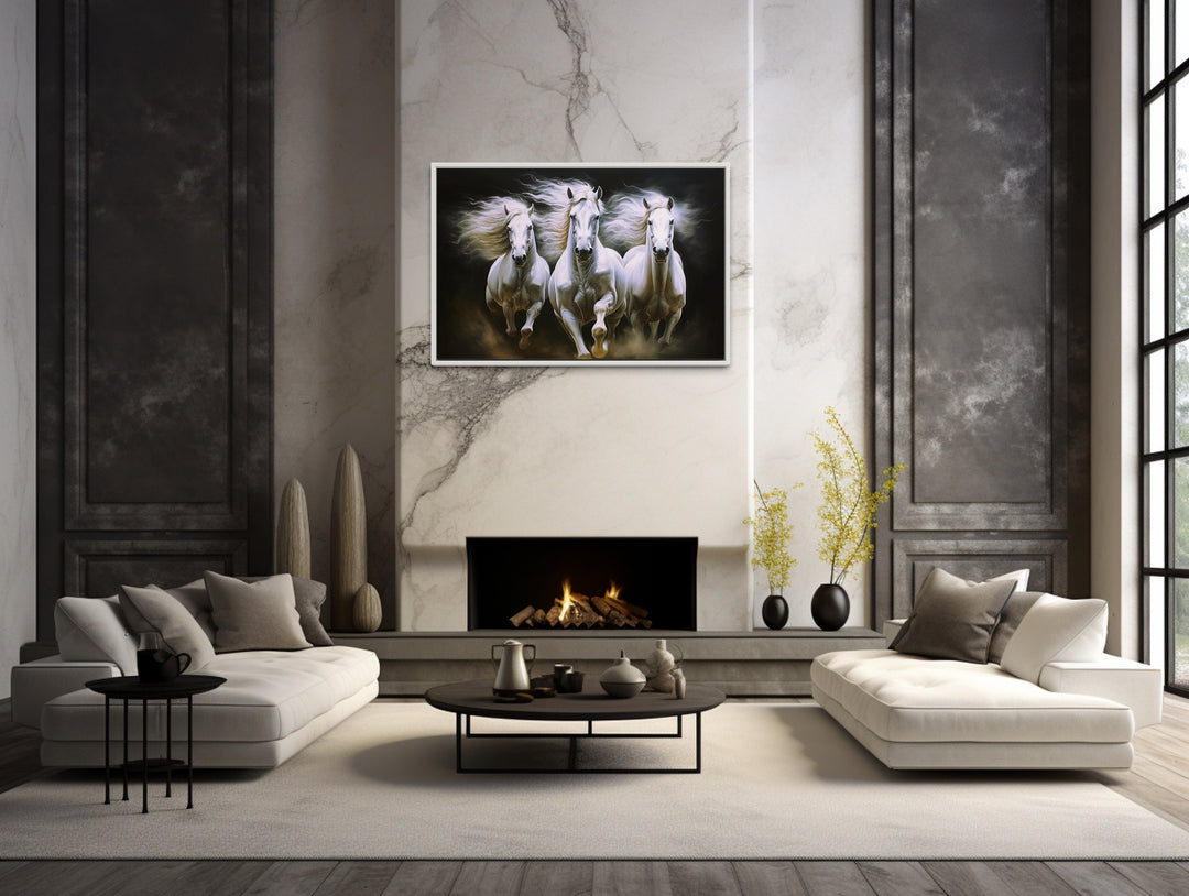 Three White Horses Running Framed Canvas Wall Art above fireplace