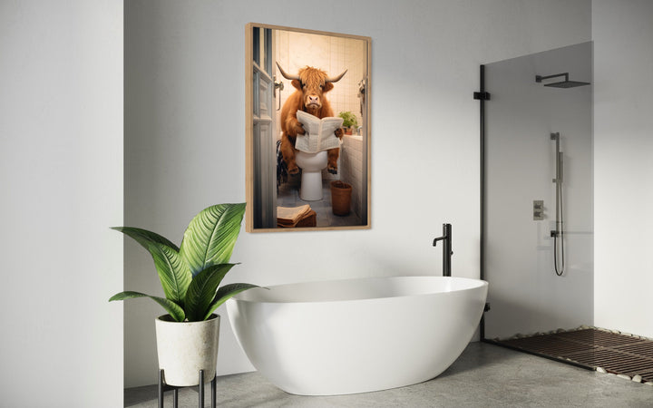 Highland Cow On The Toilet Reading Newspaper Wall Art in modern bathroom