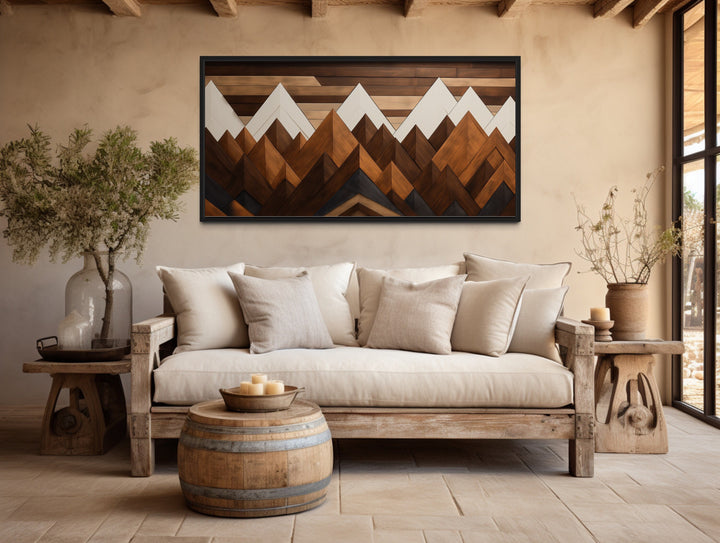 Snow Capped Mountains Layered Wood Panel Effect Canvas Wall Art above rustic couch