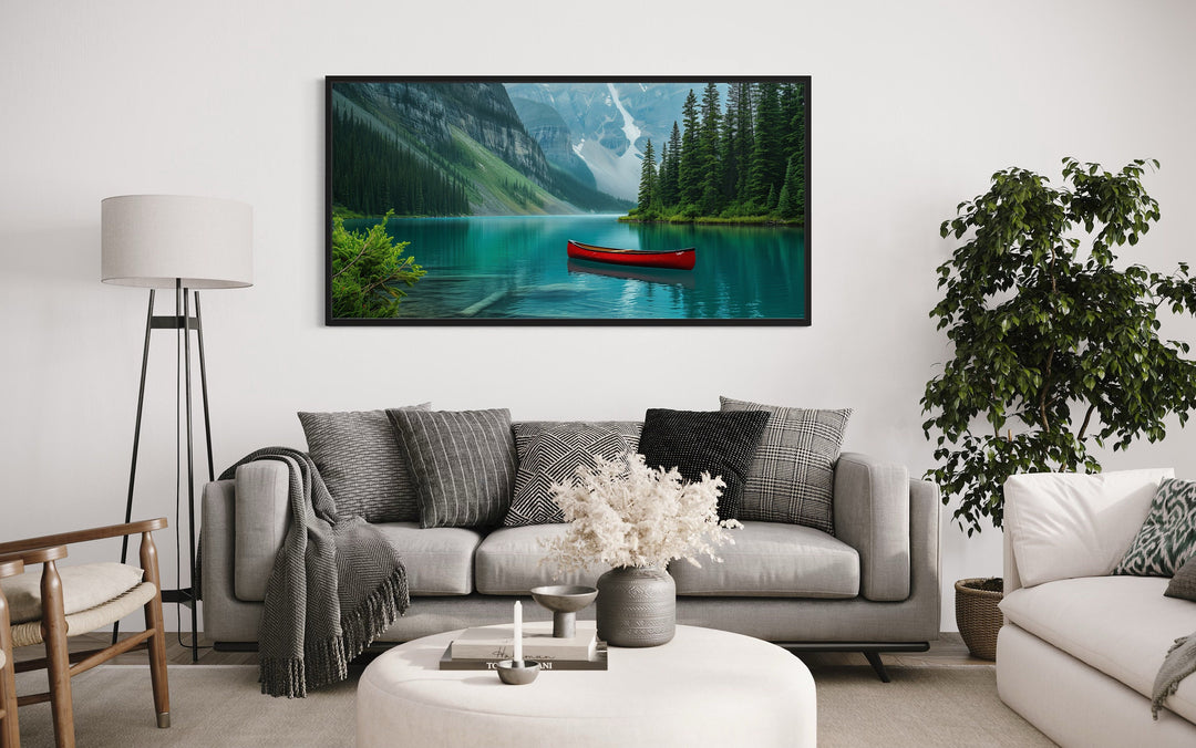Lake Louise Landscape With Red Canoe Wall Art "Emerald Serenity" over grey modern couch