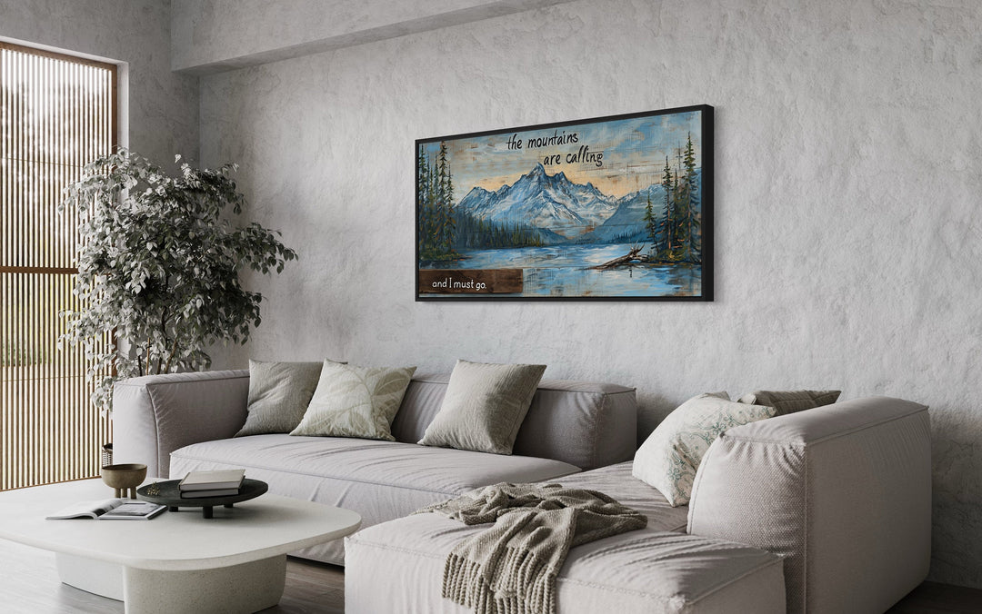 Mountains Are Calling And I Must Go Rustic Framed Canvas Wall Art above grey couch