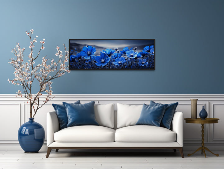 Navy Blue Flowers On Black Background Horizontal Framed Canvas Wall Art above white couch