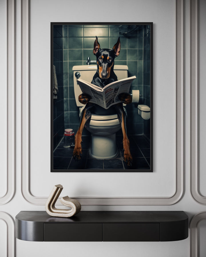 Black Dobermann Dog On The Toilet Reading Newspaper Wall Art close up