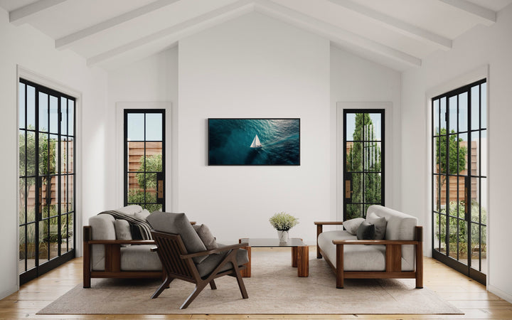 Sailboat In The Ocean Framed Canvas Nautical Wall Art in living room