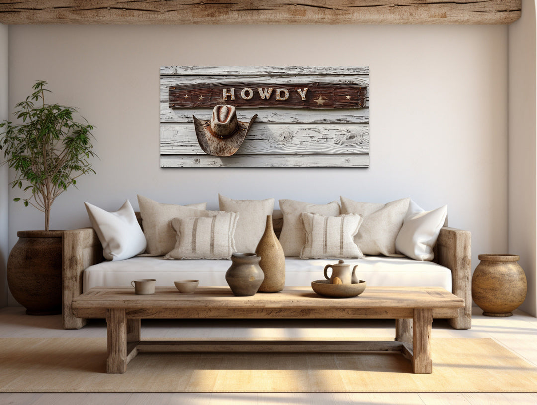 Howdy Sign Vintage Rustic Cowboy Southwestern Canvas Wall Art above southwestern couch