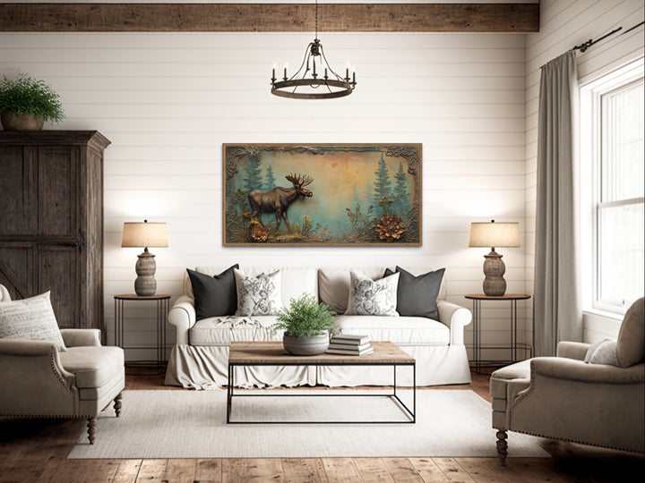 Rustic Moose Painting wall art above beige couch