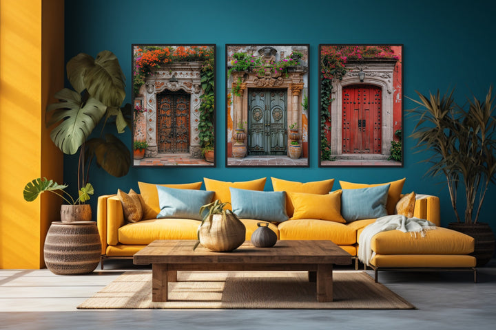 Set Of Three Mexican Doors Wall Art above yellow couch