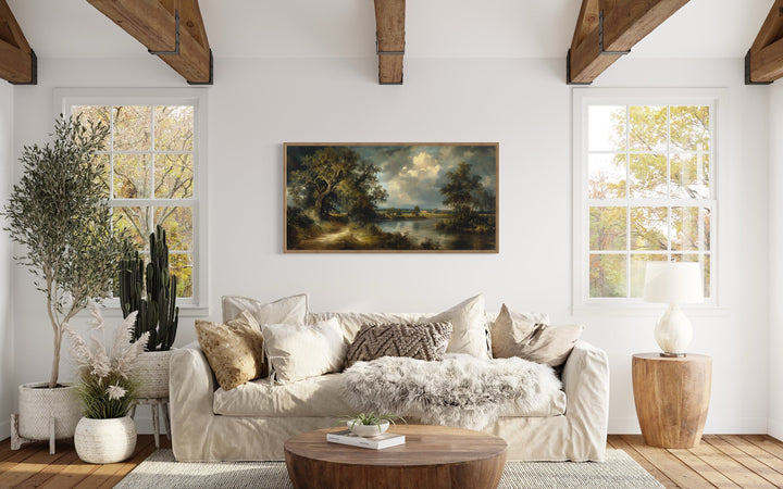 Vintage Lake Landscape Framed Canvas Wall Art above beige couch