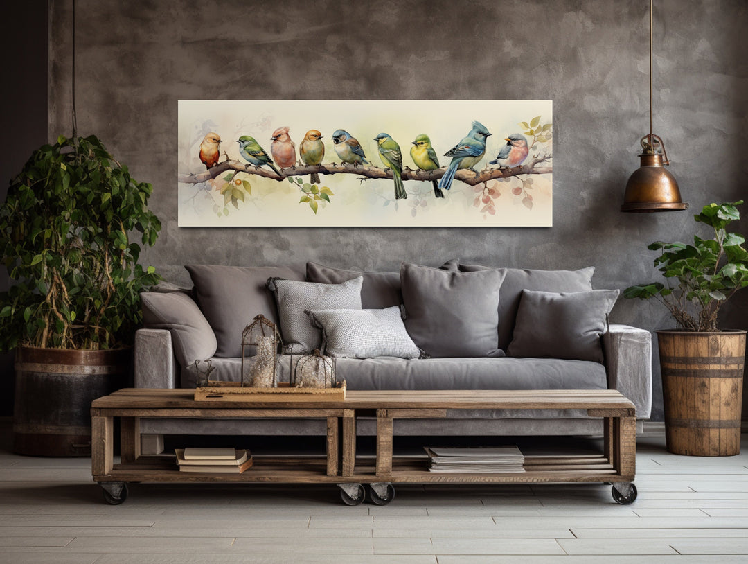 birds wall art above grey couch