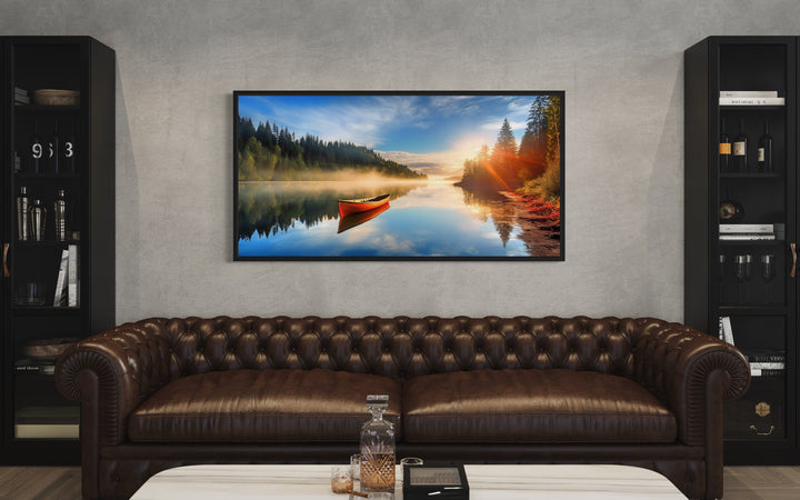 Lake With Red Canoe at Sunrise Framed Canvas Wall Art above couch