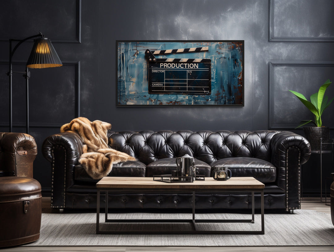 Film Clapper Canvas Wall Art above black couch