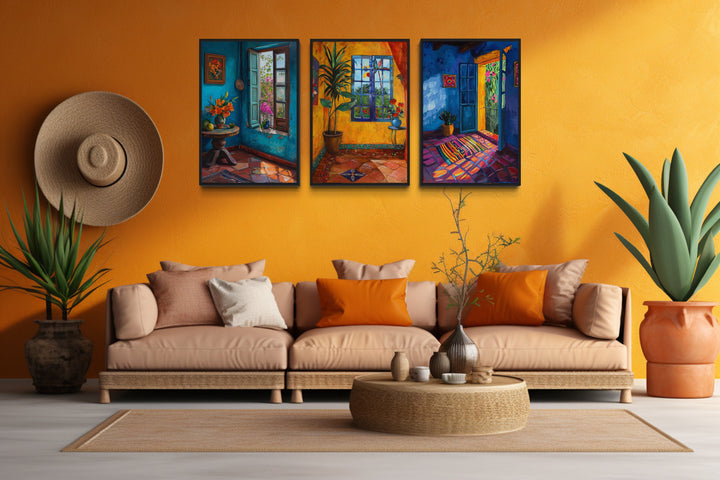 Set Of Three House And Window Mexican Wall Art above light brown couch