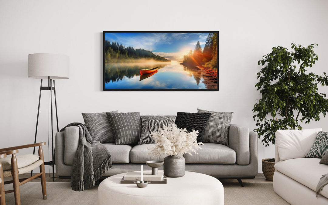 Lake With Red Canoe at Sunrise Framed Canvas Wall Art above couch