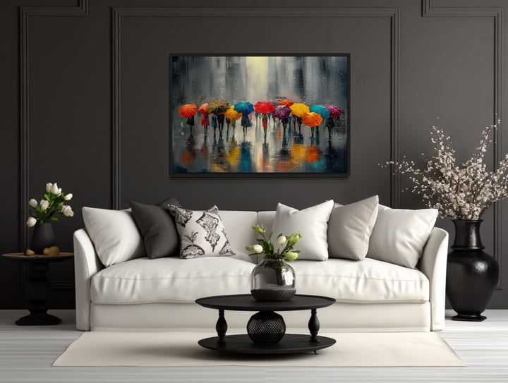 People With Colorful Umbrellas In Rainy City Framed Canvas Wall Art above white couch