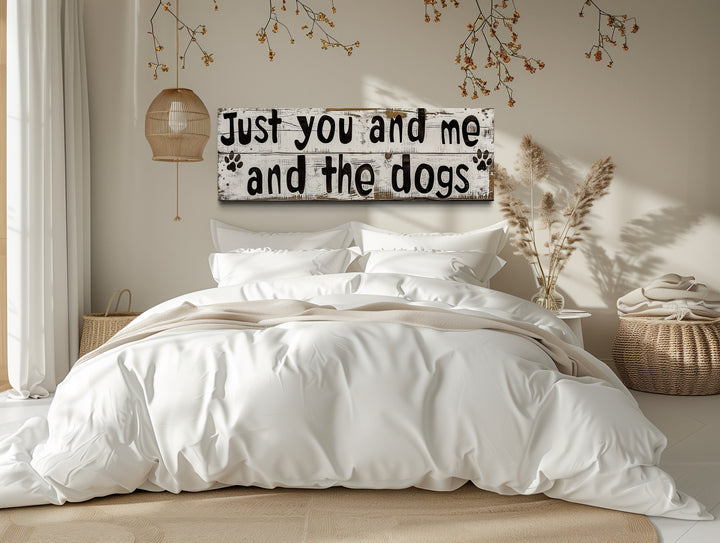 Just You And Me And The Dogs Rustic Sign Wall Art above bed