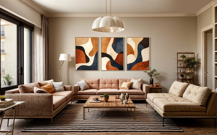 3 Piece Mid Century Modern Abstract Earth Tones Brown Cream Navy Framed Wall Art in living room