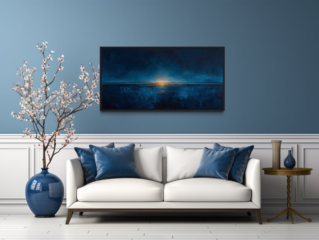 Abstract Navy Blue Gold Calm Ocean Painting Framed Canvas Wall Art above white couch