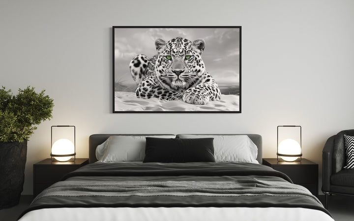 Leopard With Green Eyes Black White Photography Framed Canvas Wall Art above bed