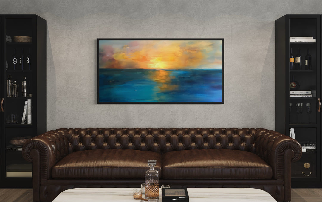 Yellow Gold Navy Abstract Ocean Sunset Living Room Framed Canvas Wall Art above brown couch