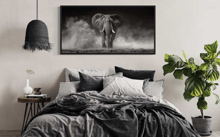 Elephant In Savanna Dust Black White Photography Framed Canvas Wall Art above bed
