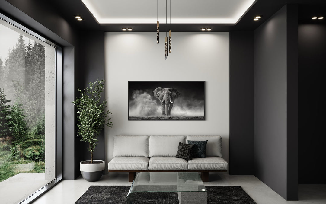 Elephant In Savanna Dust Black White Photography Framed Canvas Wall Art in living room