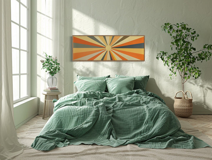 Mid Century Modern Neutral Sun Long Horizontal Framed Canvas Wall Art above green bed