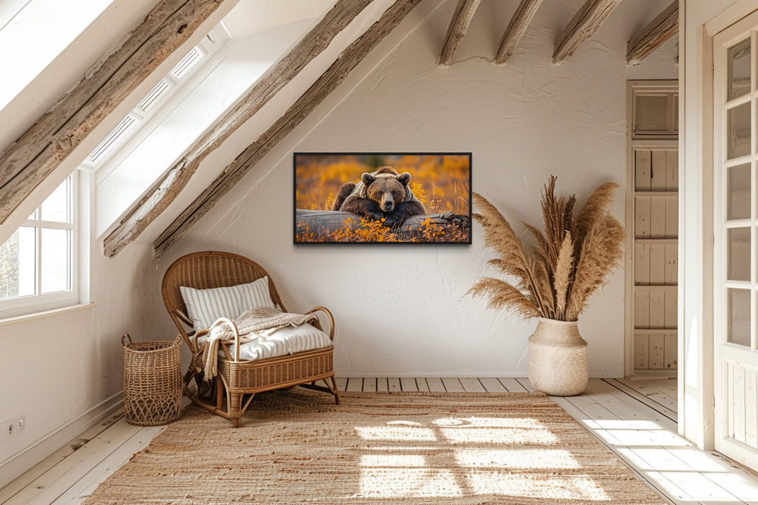 Grizzly Bear On A Log In Autumn Forest Framed Canvas Wall Art in living room