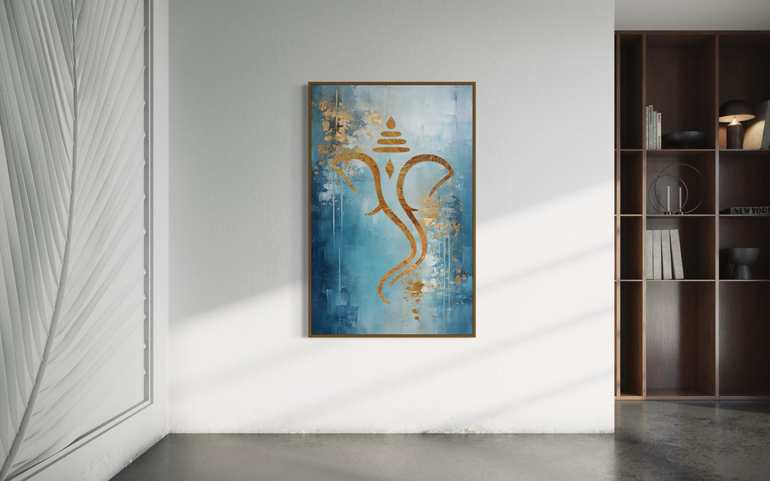 Blue Gold Minimalist Lord Ganesha Framed Canvas Wall Art in living room