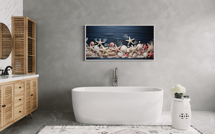 Pink Starfish And Seashells Painting On Navy Blue Wood Texture Wall Art in coastal bathroom