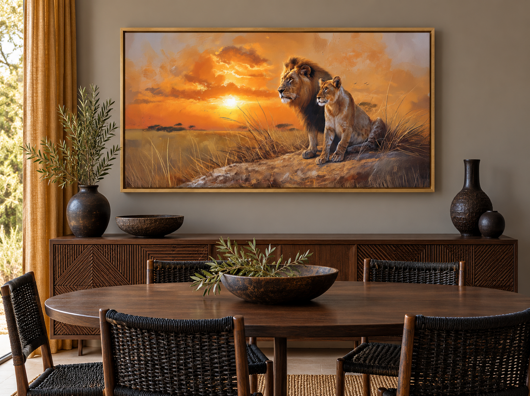 Framed canvas print of a lion and lioness at sunset over a dining room sideboard.