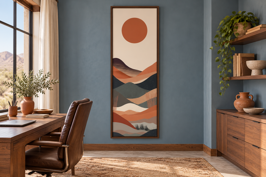 Long narrow vertical framed canvas wall art featuring a minimalist boho desert landscape and sun.