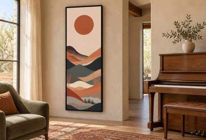 Long narrow vertical framed canvas art of a minimalist boho desert landscape with a red sun.