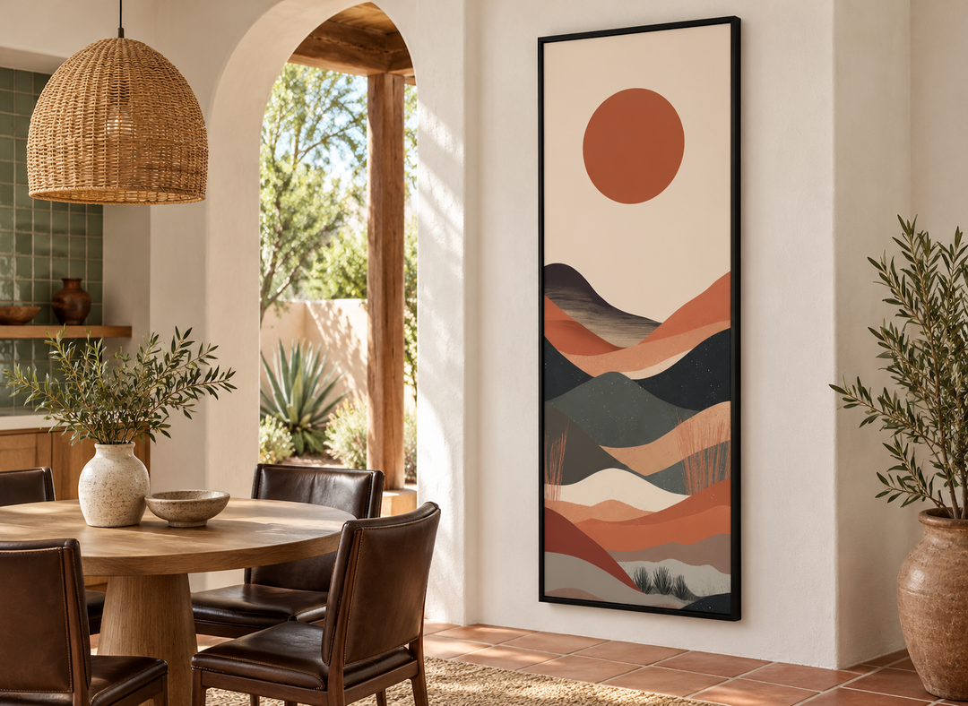 Vertical framed canvas wall art featuring a minimalist boho desert landscape in a dining room.