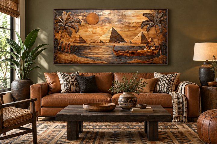 Ancient Egypt canvas print with pyramids and Nile River in a wood texture style above a brown sofa.