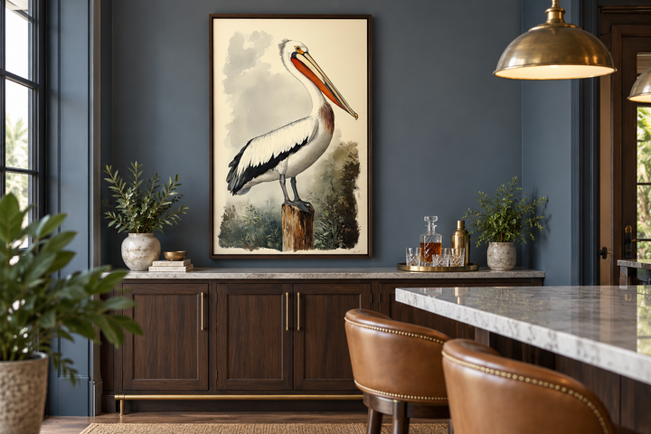 Vintage Pelican Framed Canvas Wall Art in a dark blue room above a walnut cabinet.