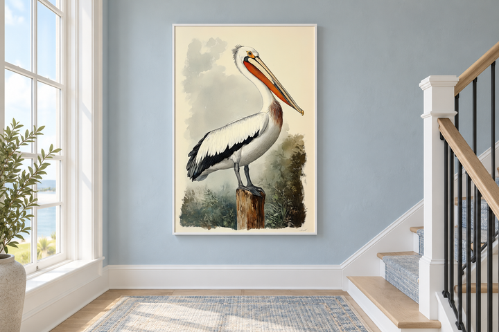 Vintage pelican illustration in a white frame, hanging on a blue wall in a coastal-style hallway.