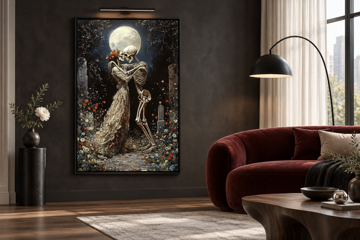 Romantic gothic wall art of two skeletons dancing in a moonlit cemetery, framed in a dark room.