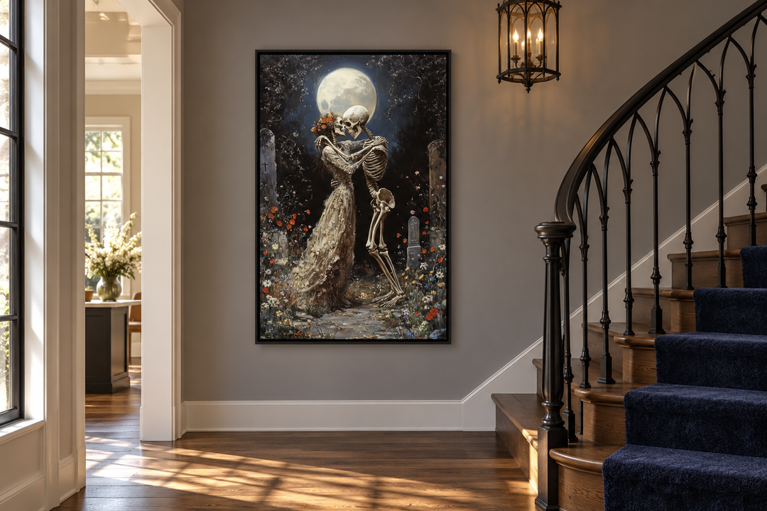 Gothic wall art of two skeletons dancing in a moonlit cemetery, framed on a gray staircase wall.