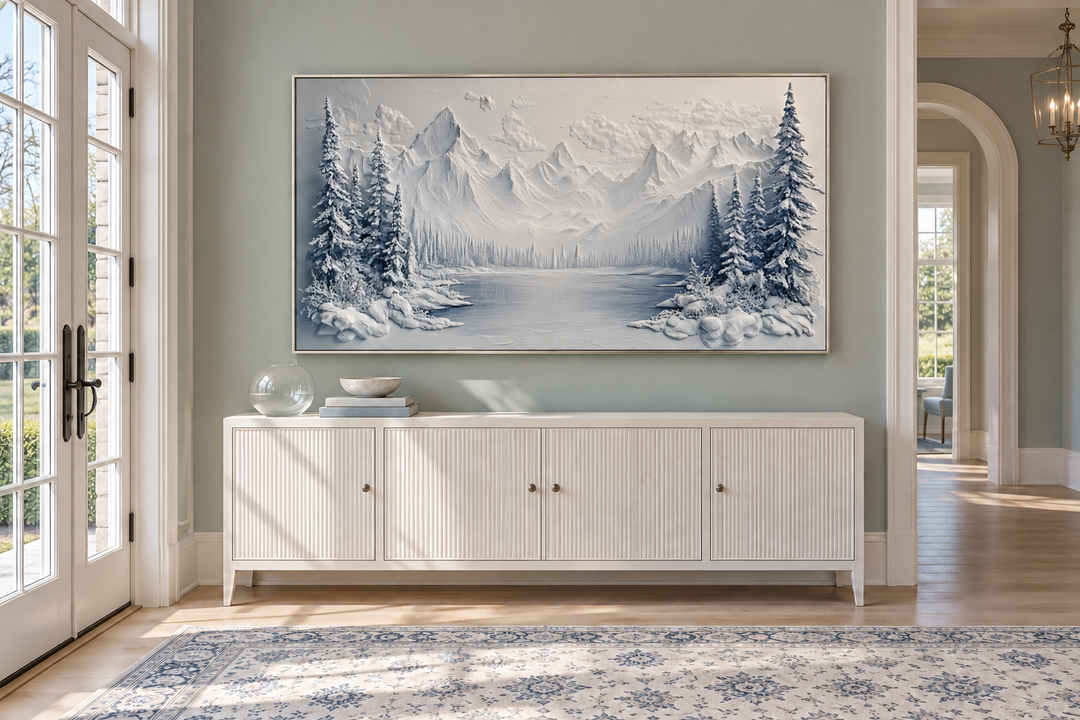 Snowy Mountain Lake With Pine Trees Winter Framed Canvas Wall Art above a white sideboard.