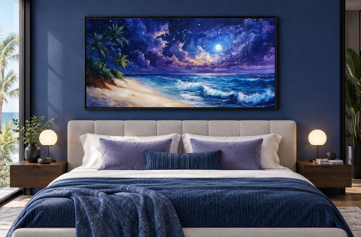 Panoramic framed canvas art of a tropical beach at night under a starry sky above a bed.