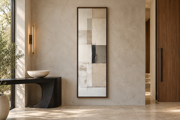 Vertical abstract geometric wall art with beige, black, and white panels in a slim walnut frame.