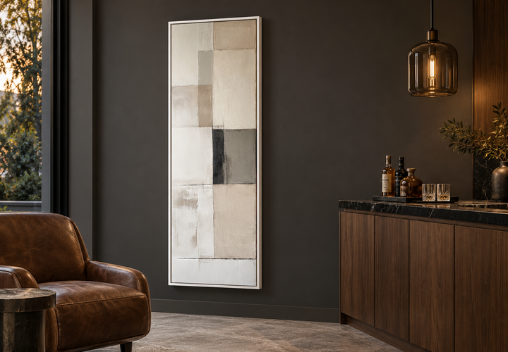 Vertical abstract geometric canvas art in neutral beige, black, and white tones in a white frame.