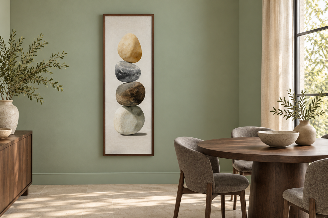 Vertical Zen Stacked Stones Canvas Wall Art in a dark wood frame on a sage green wall.