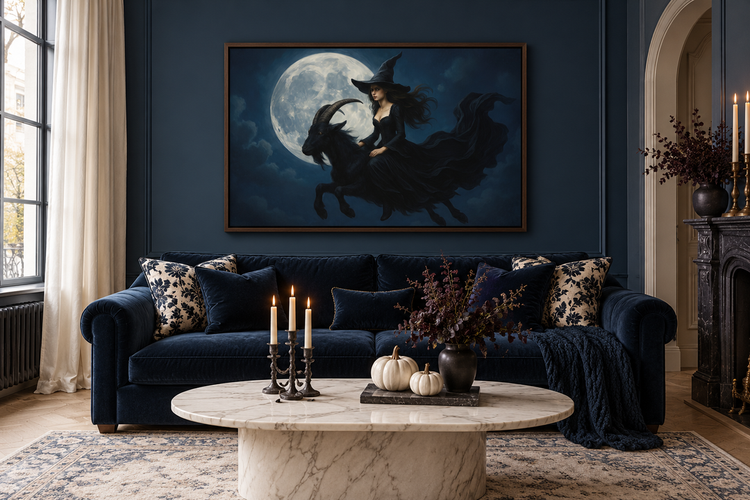 Witch flying on a black goat at full moon Halloween wall art in a walnut frame over a blue sofa.